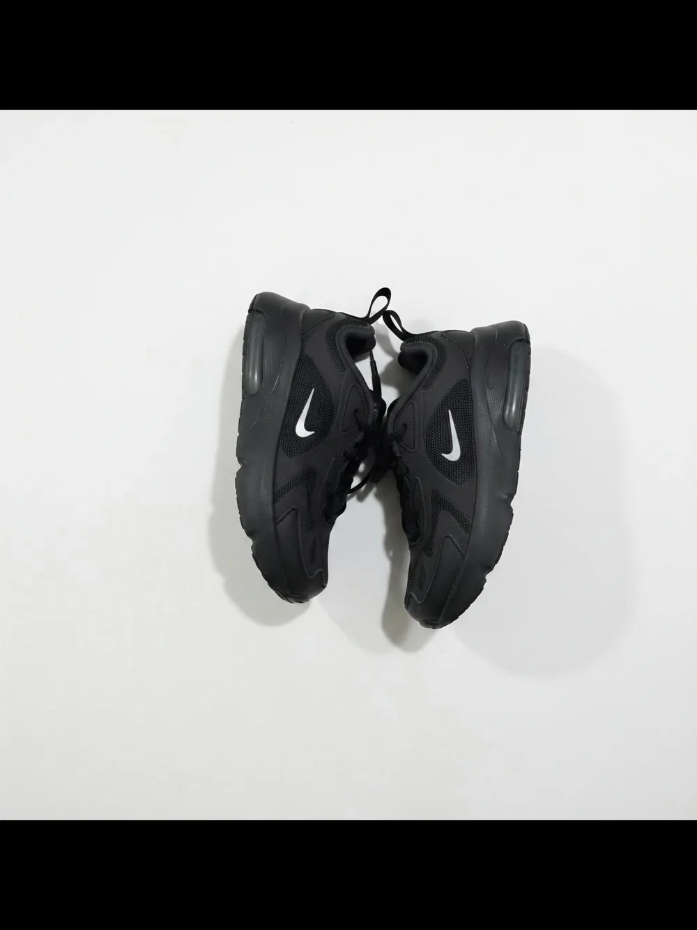 Nike Kids Black Sneakers with White Swoosh